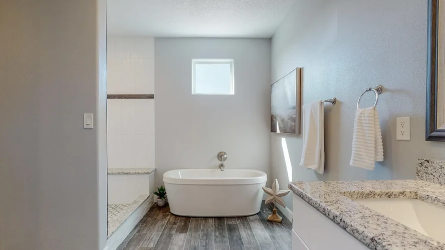 Modern bathroom remodel with stand-alone soaking tub