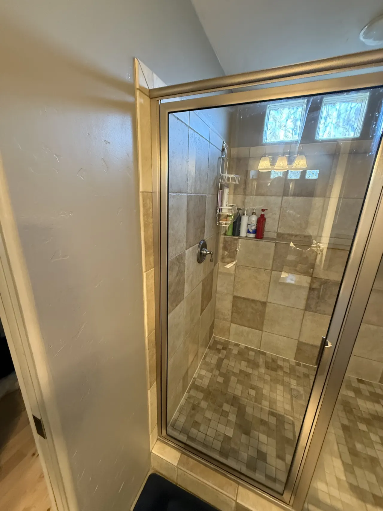 Warm tile shower with glass