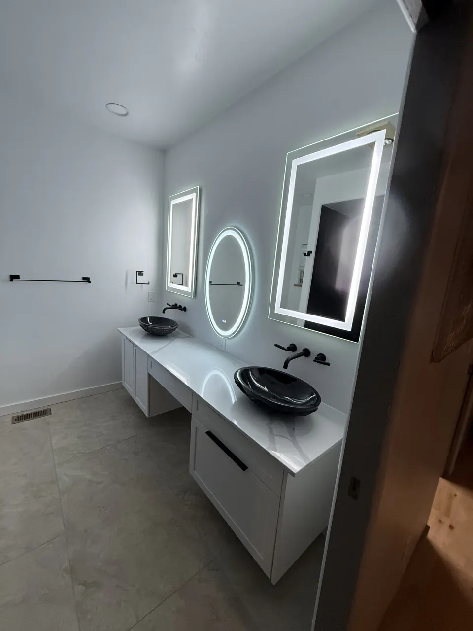 Double vanity and illuminated mirrors
