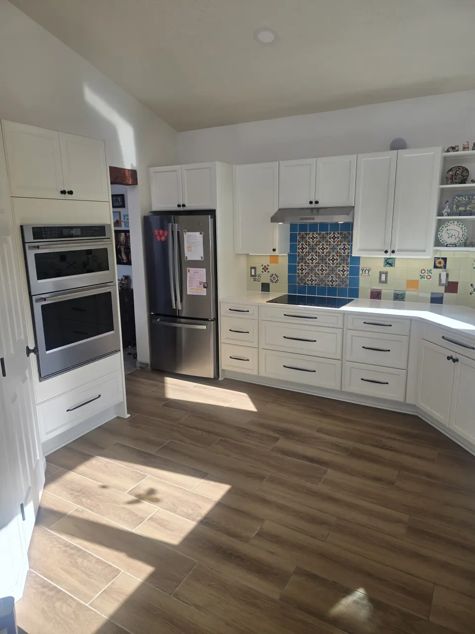 White kitchen appliance and backsplash corner